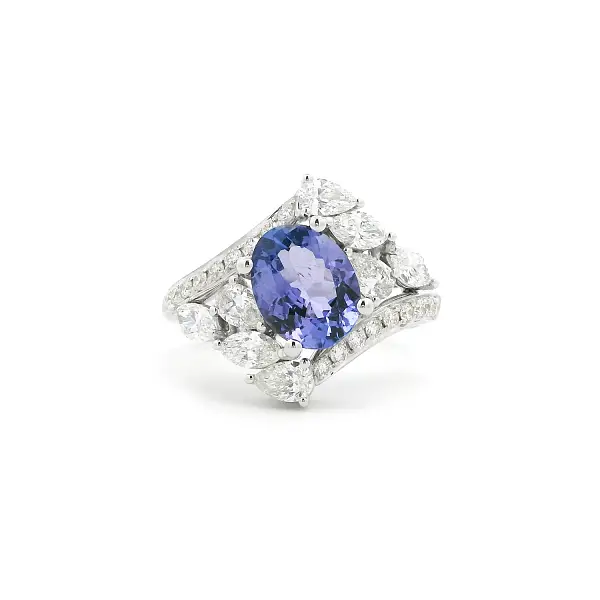 Luxury White Gold Ring with Oval Tanzanite and Pear-Shaped Diamonds
