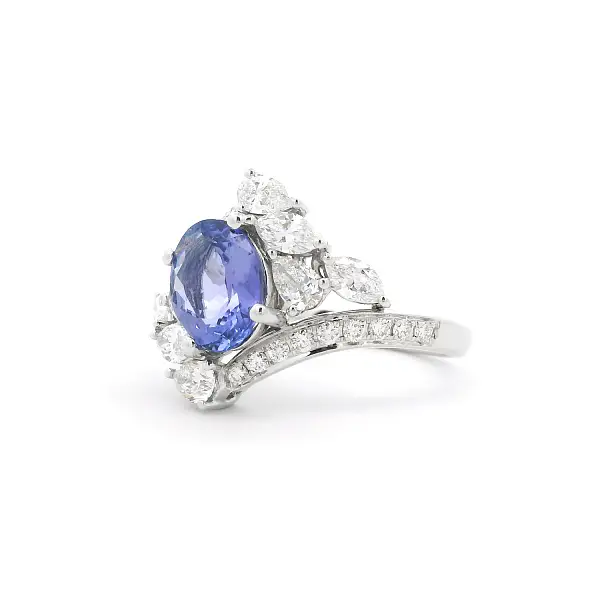 Luxury White Gold Ring with Oval Tanzanite and Pear-Shaped Diamonds