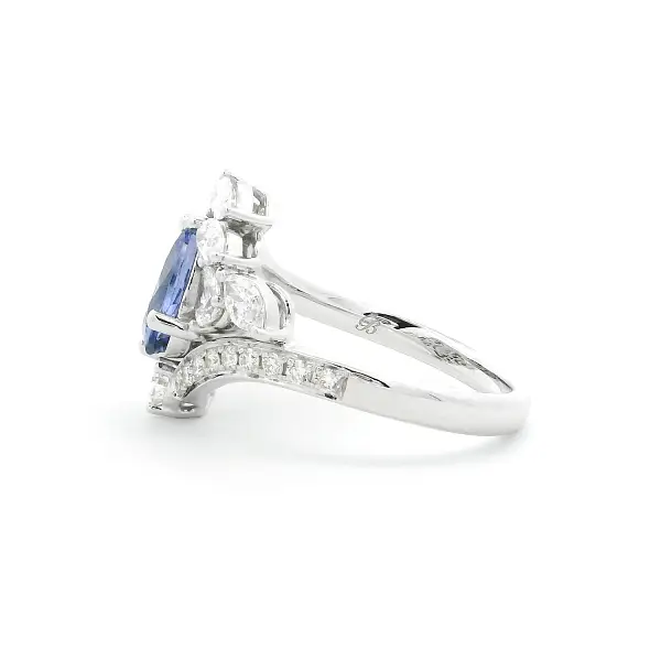 Luxury White Gold Ring with Oval Tanzanite and Pear-Shaped Diamonds