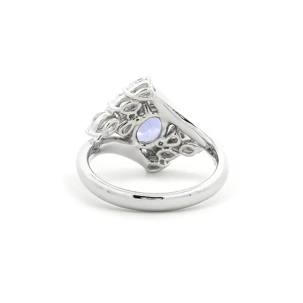 Luxury White Gold Ring with Oval Tanzanite and Pear-Shaped Diamonds