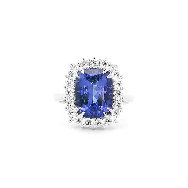 Luxury Ring with Tanzanite Surrounded by Diamonds in White Gold