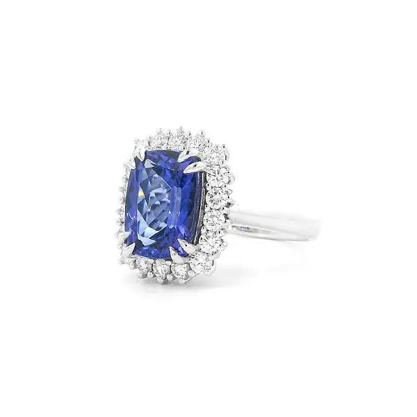 Luxury Ring with Tanzanite Surrounded by Diamonds in White Gold