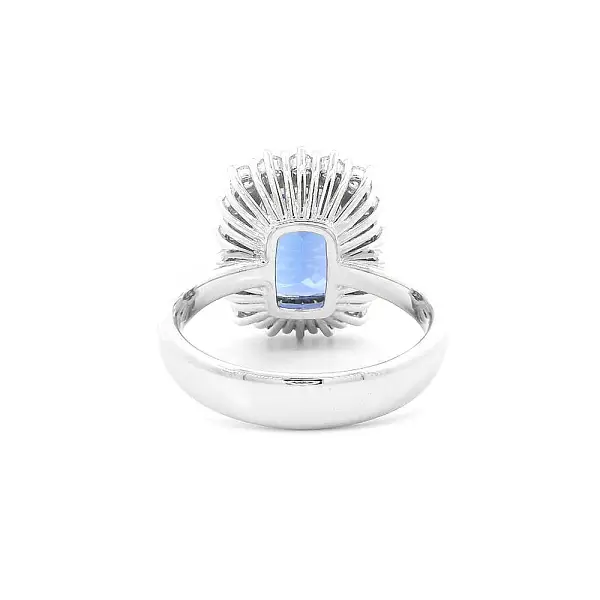 Luxury Ring with Tanzanite Surrounded by Diamonds in White Gold