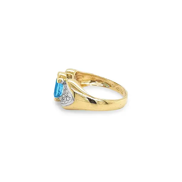 Exclusive Gold Ring with Blue Topaz and Zirconia